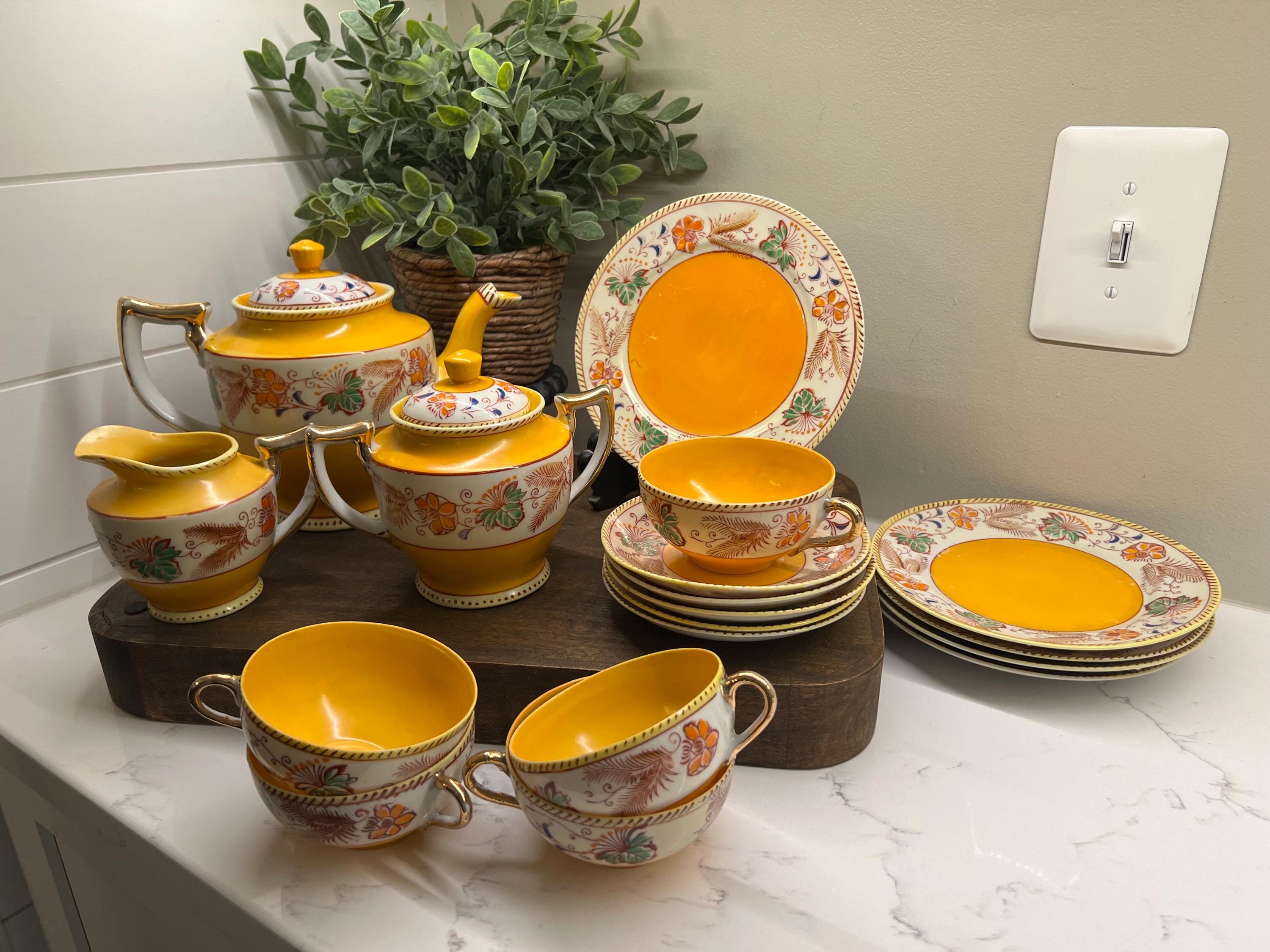 Antique rare Japanese sunshine yellow with handpainted flowers, gold accents, teapot, sugar bowl, creamer, teacups/saucers, dessert plates