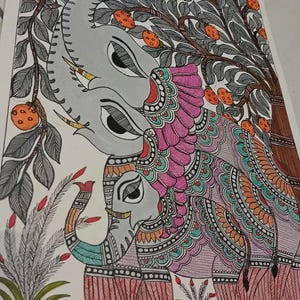 May include: An artistic illustration of two elephants under a fruit tree. The elephants are gray with intricate patterns in pink, orange, and teal. The tree has orange fruits and gray leaves, with a brown trunk. The artwork is on a white background.