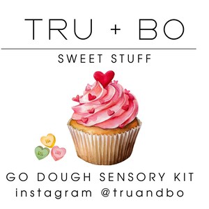 May include: A watercolour illustration of a cupcake with pink frosting and heart-shaped sprinkles. The cupcake is in a brown paper case, with three candy hearts. Text includes "TRU + BO", "SWEET STUFF", and "GO DOUGH SENSORY KIT".