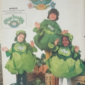 May include: A vintage sewing pattern for Cabbage Patch Kids costumes. The pattern includes instructions for making three different cabbage patch costumes, each with a different design. The pattern is from the Butterick company and has the number 6920 printed on it.