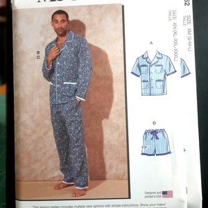 May include: McCall's M8262 sewing pattern envelope featuring a blue and white patterned pajama set with a long-sleeve button-up shirt and matching pants. The envelope displays technical illustrations for short-sleeve and short variations.