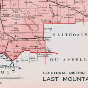 May include: A map of the Last Mountain electoral district in Saskatchewan, Canada. The map shows the boundaries of the district, as well as the locations of various towns and cities. The map is in pink and red, with black lines for roads and rivers. The text "ELECTORAL DISTRICT OF LAST MOUNTAIN" is printed in green at the bottom of the map.