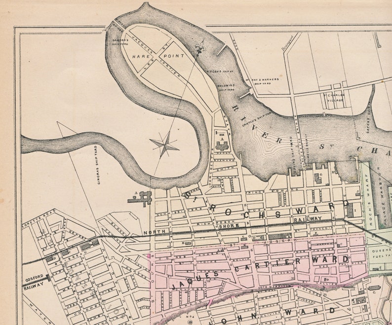 May include: A vintage map of Rochester, New York, showing the city's layout and streets. The map is in black and white with some pink and blue highlights. The map includes the names of the different wards, including the North Shore, Rochester, and Cartier wards. The map also shows the location of the Genesee River and the city's railroad.