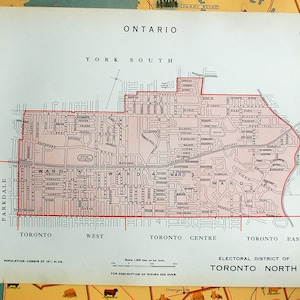 May include: A vintage map of Toronto, Ontario, Canada, showing the city's wards and boundaries. The map is dated 1911 and includes the text "ELECTORAL DISTRICT OF TORONTO NORTH".