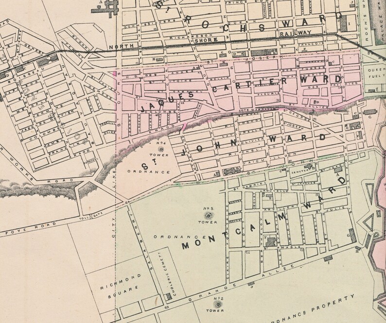 May include: A vintage map of a city with labeled wards, including Jacques Cartier Ward, John Ward, and Montreal Ward. The map shows streets, buildings, and landmarks, including a railway, a tower, and a cemetery.