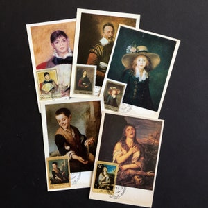 May include: A collection of vintage postcards featuring portraits of people. The postcards are framed with a white border and have stamps in the corner. The stamps feature images of people and the text "ПОЧТА СССР".