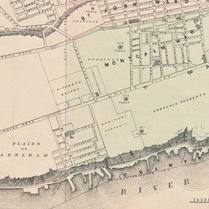 May include: A vintage map of a city with the words "Plains of Abraham" and "Richmond Square" labeled. The map shows a river, a cemetery, and a large area labeled "Ordnance Property".