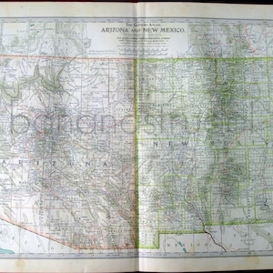 May include: A vintage map of Arizona and New Mexico, showing state borders, cities, and towns. The map is printed in black and white with green and red accents. The map is titled "The Century Atlas, Arizona and New Mexico."