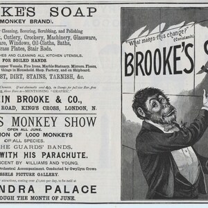 May include: Vintage advertisement for Brooke's Soap, featuring a monkey in a suit pointing at the soap's name. The ad lists uses for cleaning, including metal, marble, and dishes. The text also mentions a monkey show at Alexandra Palace.