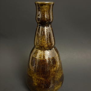 Dark speckled glossy ceramic vase