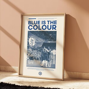 May include: A vintage-style poster with a blue and white color scheme featuring a photo of a soccer game. The poster has the text "BLUE IS THE COLOUR" and a Chelsea Football Club logo.