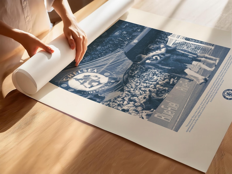 May include: A blue and white poster featuring a vintage photograph of a Chelsea Football Club match. The poster includes the Chelsea Football Club logo and the text "Bluebirds Rise".