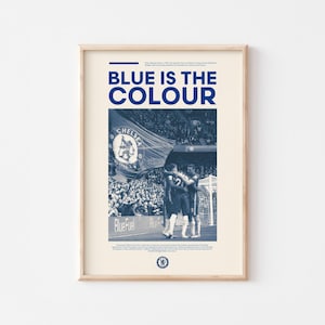 May include: A blue and white poster with the text "BLUE IS THE COLOUR" and a photo of a crowd of people at a soccer game. The photo shows a group of players celebrating a goal. The poster also includes the Chelsea Football Club logo.