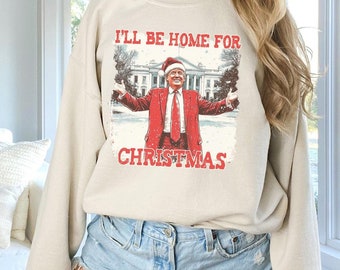 クリスマスには家に帰りますシャツ、ユーモラスなクリスマストランプシャツ、クリスマスドナルドトランプシャツ、ファミリークリスマスシャツ、トランプファンクリスマスTシャツ