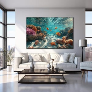 May include: A rectangular wall art print featuring an underwater scene with vibrant orange clownfish swimming near a colorful coral reef, a bright orange starfish resting on the sandy ocean floor, and sunlight filtering through the water surface.