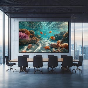 May include: A large rectangular wall art print depicting an underwater coral reef scene with orange clownfish, a bright orange starfish, and various textured seashells resting on a sandy ocean floor beneath clear blue sunlit water.