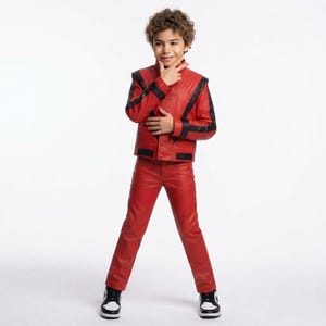 May include: A bright red leather jacket and matching red leather pants set. The jacket features black leather accents along the shoulders, sleeves, and hem, with a high collar and front button closure. The pants are straight-legged and solid red.