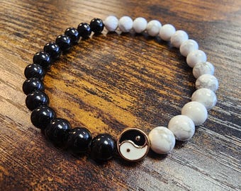 HOWLITE and OBSIDIAN gemstone bracelet. (7” stretch bracelet) Natural 6mm Gemstone beads. You will receive ONE bracelet.