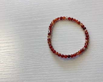 CARNELIAN gemstone bracelet. (7” stretch bracelet) Natural 2mmGemstone beads. You will receive ONE bracelet.