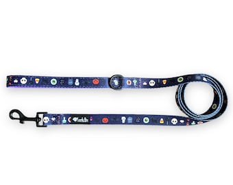 May include: A blue and purple dog leash with a Halloween theme. The leash is decorated with various Halloween icons, including ghosts, pumpkins, bats, and candy corn. The leash has a black metal clip and a black metal ring.
