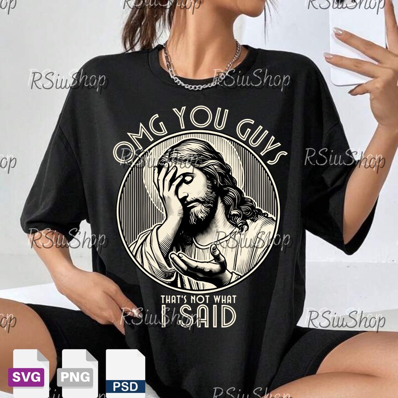 May include: Black t-shirt with a graphic of Jesus with his hand on his forehead, inside a circle with the words "OMG YOU GUYS" above and "THAT'S NOT WHAT SAID" below. The shirt has short sleeves.