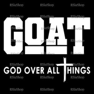 May include: A black graphic design featuring the word "GOAT" in white, bold capital letters, above the phrase "GOD OVER ALL THINGS" and a white cross. The design is centered.