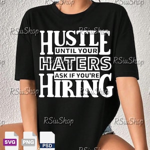 May include: Black t-shirt with the white text "Hustle Until Your Haters Ask If You're Hiring." The shirt has short sleeves and a crew neck. The design is centered on the front of the shirt.