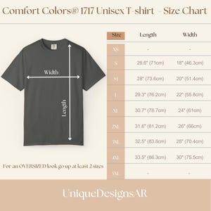 May include: A size chart for a Comfort Colors 1717 unisex t-shirt. The chart shows measurements for sizes XS to 4XL, including length and width in inches and centimeters. The text advises sizing up for an oversized fit. The brand name UniqueDesignsAR is at the bottom.