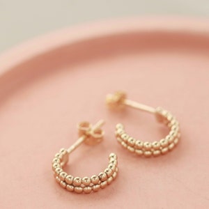 gold huggie earrings uk