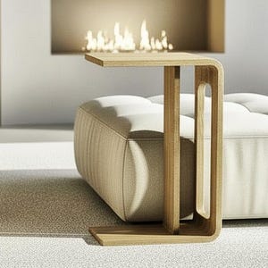 Perfect for modern living rooms, this minimalist C-form side table is handcrafted from solid oak. Features smooth wheels and a built-in magazine rack for ultimate convenience.