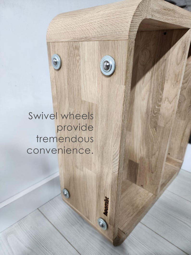 Perfect for modern living rooms, this minimalist C-form side table is handcrafted from solid oak. Features smooth wheels and a built-in magazine rack for ultimate convenience.
