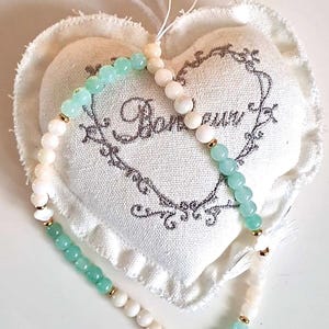 Natural pearl and gold phone jewel