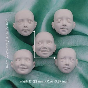 May include: Five unpainted doll faces with various expressions. The faces are off-white and measure 0.67-0.87 inches wide and 0.87-0.91 inches tall. The faces include a smiling face and faces with neutral expressions.