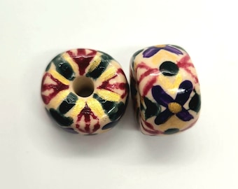 Hand Painted Large Hole Polymer Clay Beads Burgundy, Green, Purple and Gold on an Off White Background