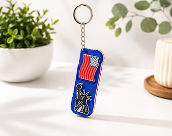 Brelok 3 w 1 z flagą USA | Podstawka na telefon i suwak | Brelok z flagą USA | Brelok antystresowy | Patriotyczny prezent