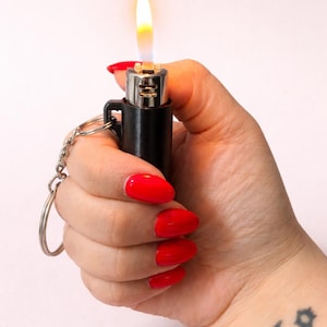 china red cigarette Red Chinese cigarette pack with illustration Free Photo