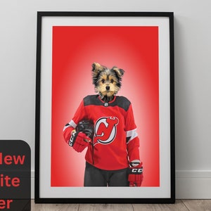 May include: Framed print featuring a dog wearing a red and black hockey jersey with the team logo. The dog is holding a hockey glove and helmet. The text "Your New Favorite Player" is on a black square in the lower left corner.