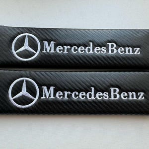 Set di 2 cuscini per cintura di sicurezza di alta qualità, protezioni per le spalle effetto carbonio per cinture di sicurezza Mercedes Benz