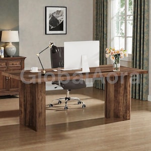 May include: A large, dark brown wooden desk with a matching base. A white computer monitor, black desk lamp, and a cup and saucer are on the desk. A black office chair sits in front of the desk. A vase of flowers sits on the desk near a window.