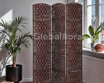 May include: A three-panel room divider with a woven brown pattern. The divider is made of a dark brown material and has a rectangular shape. The text "Globalflora" is visible on the divider. The divider is placed in front of a window.