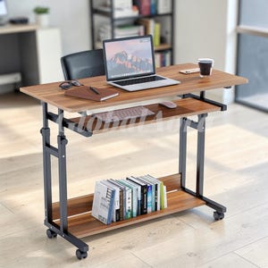 May include: A brown adjustable laptop desk with a black metal frame. The desk features a keyboard tray, a lower shelf for books, and rolling wheels. A laptop, notebook, and accessories are on the top surface.