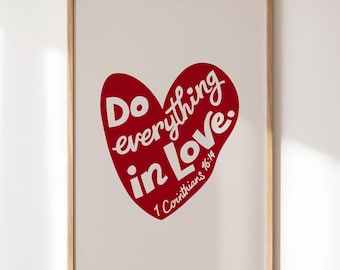 May include: A framed print with a red heart shape containing the text "Do everything in Love." and the scripture reference "1 Corinthians 16:14".