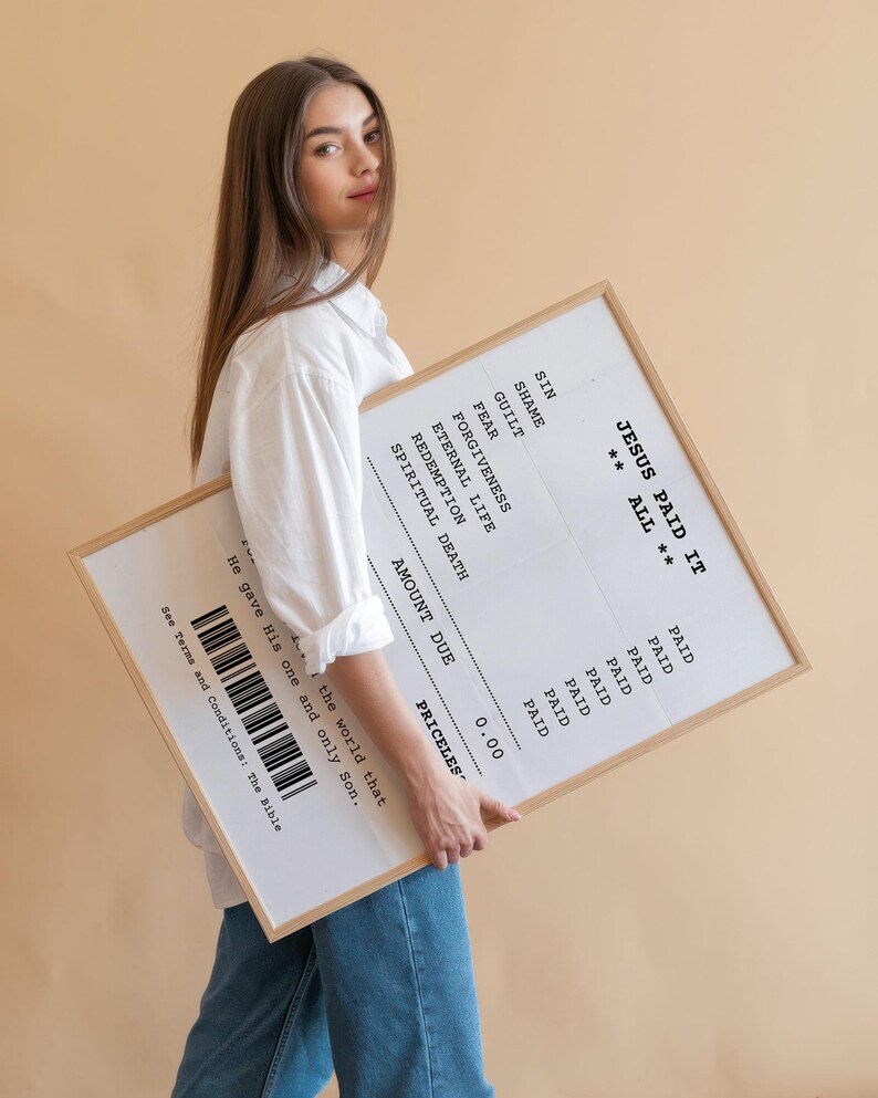 May include: A white framed print with a receipt-style design that reads "Jesus Paid It All" with a list of items and the price "Priceless".