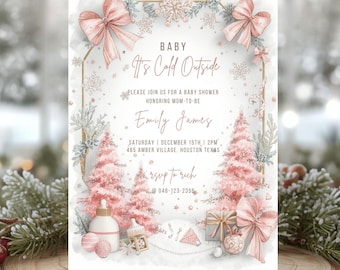 May include: A baby shower invitation with a winter theme. The invitation features pink bows, snowflakes, and Christmas trees. The text reads "Baby, It's Cold Outside" and includes event details. The invitation is on a wooden slice.