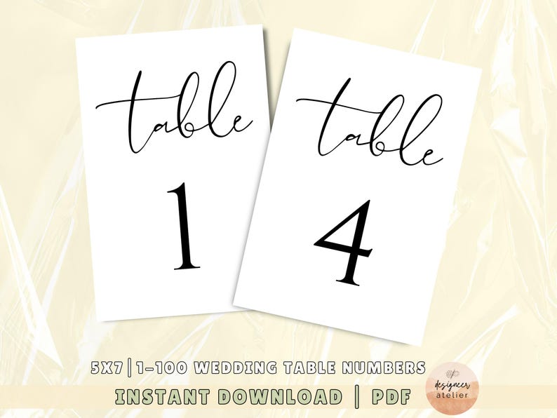 May include: Two white printable table number cards with black text. The text reads "table" and the numbers "1" and "4". The cards are 5x7 inches and are part of a set of 1-100 wedding table numbers.