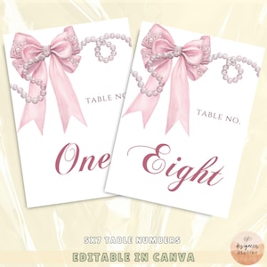 May include: Two printable table number cards with a pink bow and pearl necklace design. The cards say "Table No. One" and "Table No. Eight".