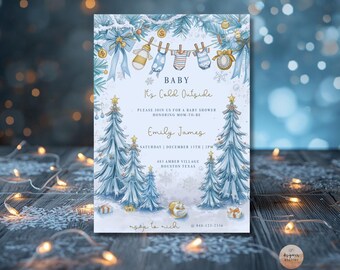 May include: A winter-themed baby shower invitation with a watercolor design. The invitation features text that reads "Baby, It's Cold Outside" and includes details for a baby shower honoring Emily James. The design includes snow-covered trees and baby clothes.