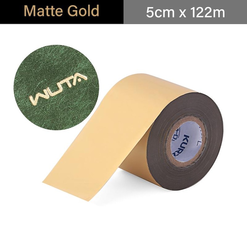 May include: A roll of matte gold foil tape, 5cm wide and 122m long, with a brown core. The tape is unrolled, revealing a light tan adhesive side. A circular emblem with the word "WUTA" is visible.