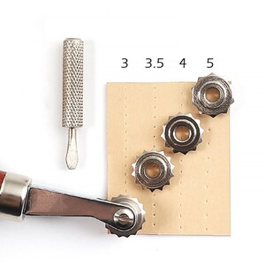 May include: A set of four leather stitching tools with different sized wheels for creating decorative stitching on leather. The tools are made of metal and have a wooden handle. The numbers 3, 3.5, 4, and 5 are printed on a piece of leather.