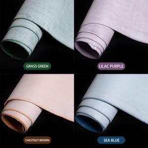 May include: Four rolls of leather in grass green, lilac purple, chestnut brown, and sea blue. Each roll is tightly curled, showing the edges of the material. The color names are displayed in text below each roll.